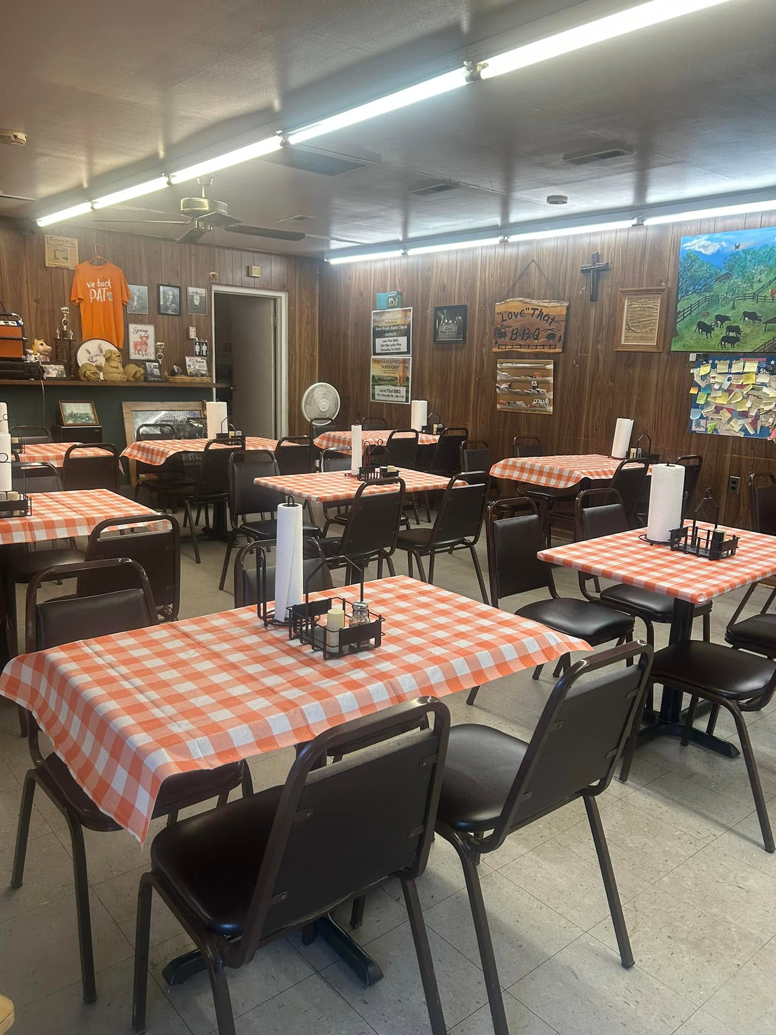 Love That BBQ’s dining room with orange checked tablecloths
