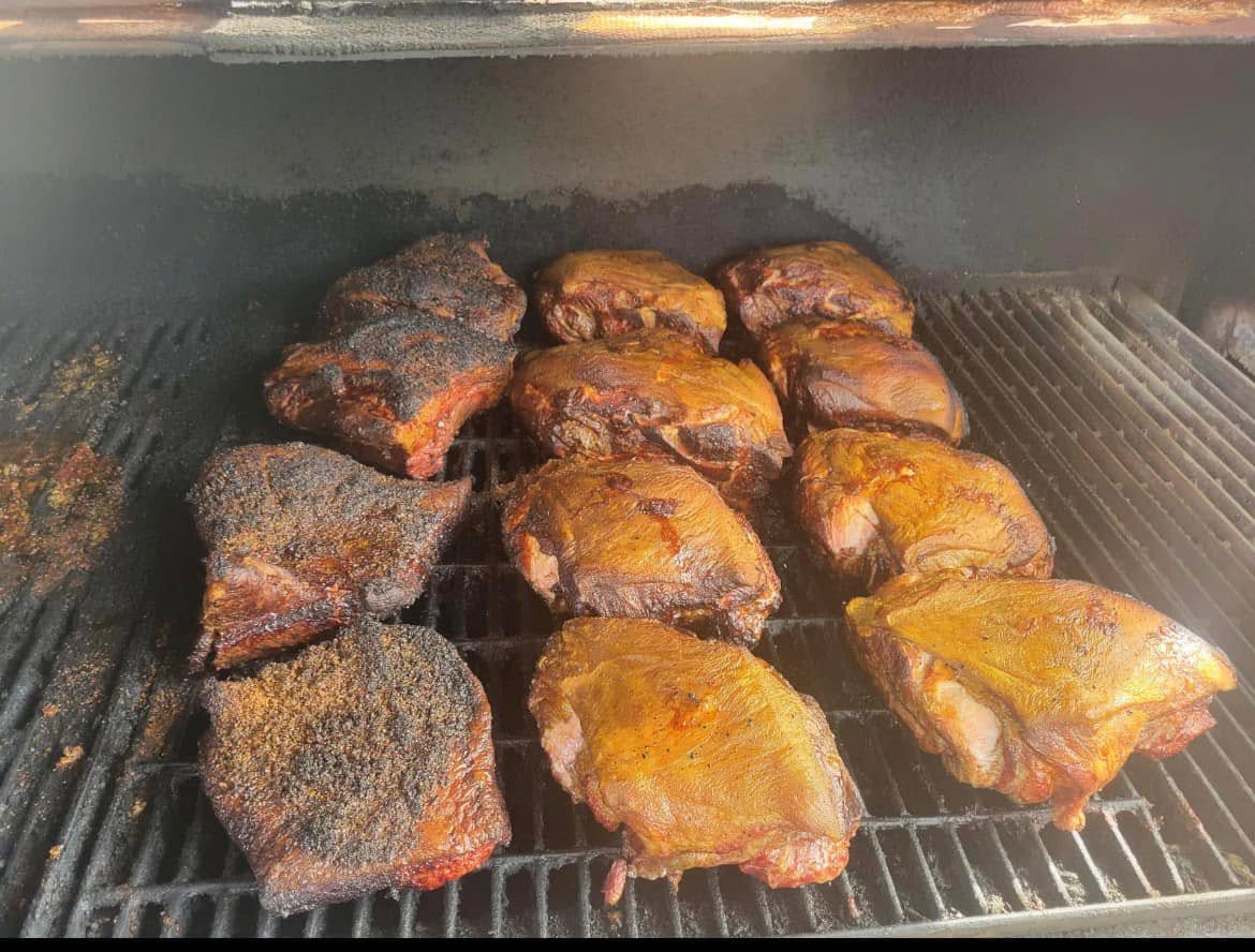 Barbecue cooking in Love That BBQ’s smoker